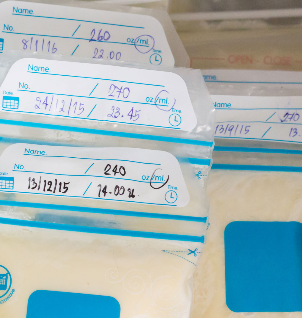 Labeled breast milk storage bags organized neatly