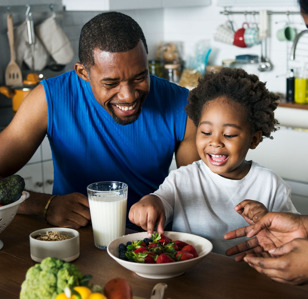 Family enjoying healthy meal together, smiling