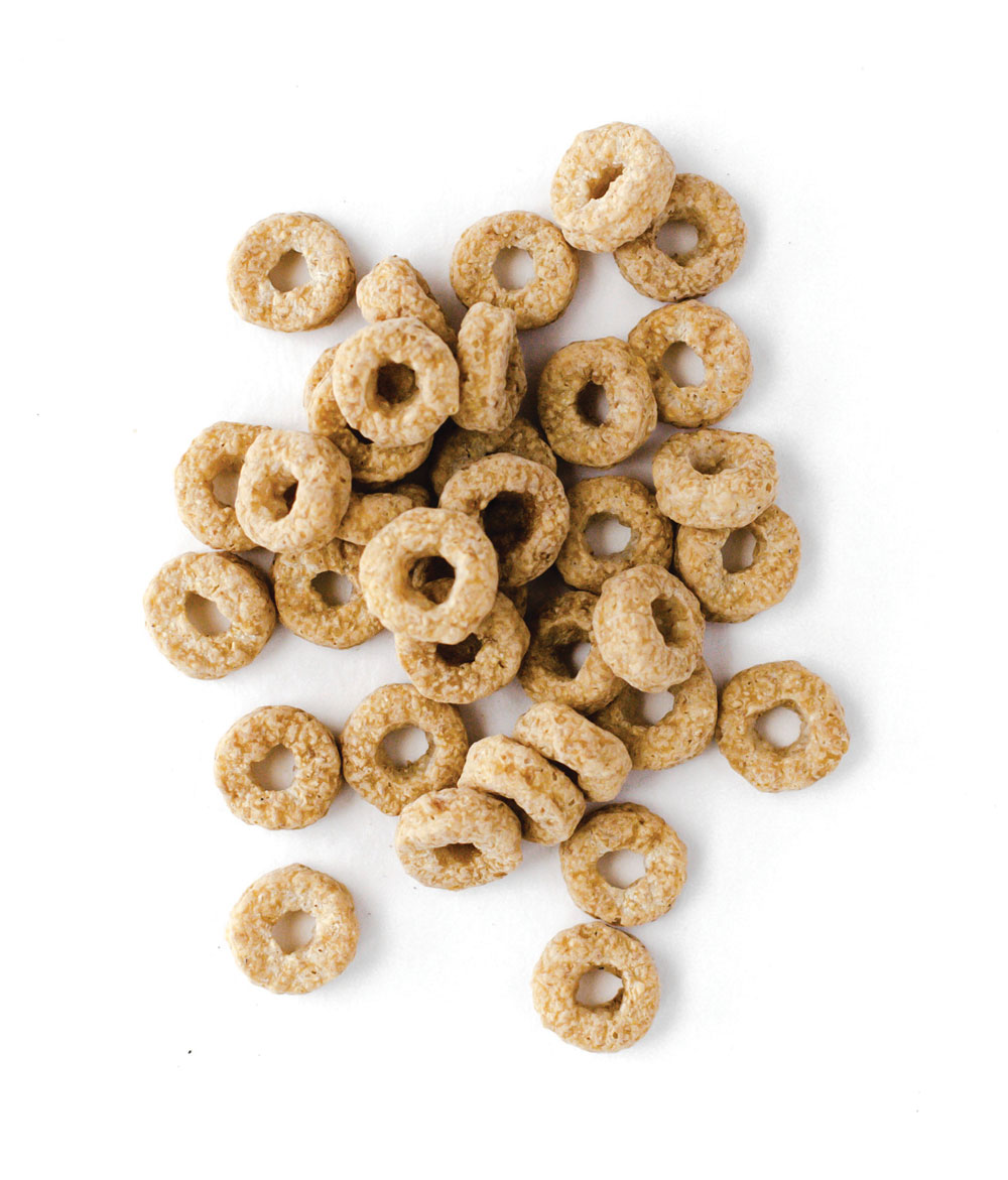 Oat ring cereal pile on white background