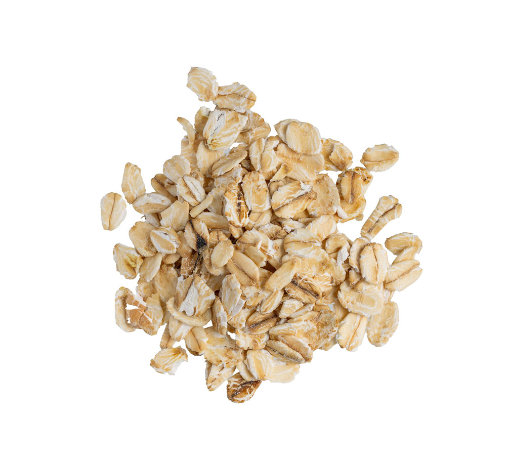 Pile of rolled oats on white background